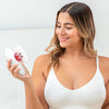Mujer sosteniendo Redu Sculpt con CTA: ‘¿Tienes preguntas? Contacta a nuestro equipo